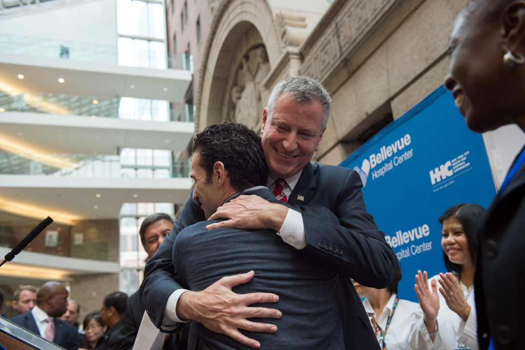 Dr. Craig Spencer hugs Mayor Bill de Blasio after leaving Bellevue Hospital