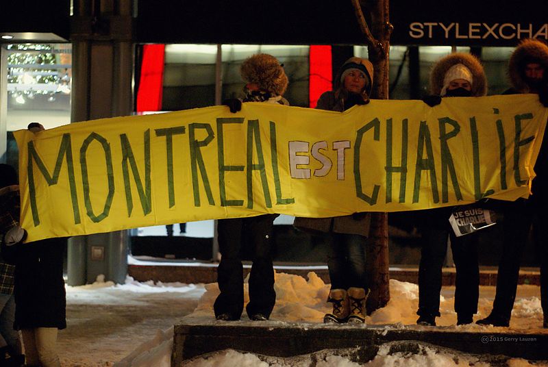 "Montreal is Charlie". Protesters in Montreal, Canada hold up a sign in solidarity with Paris. Credit: Wikimedia Commons