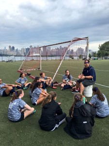 Coach Morki gave the Varsity Soccer team a pep talk before their game. Credit: Hewitt Athletics Twitter