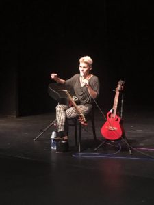 King answers a student's question with one guitar on her lap and the other on her stand. Source: Jenny Kirsch, Twitter