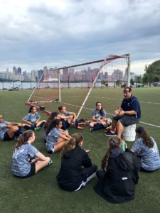 Credit: Hewitt Athletics Twitter Page. Beau Morki is giving the Varsity Soccer team a pep talk at half time.