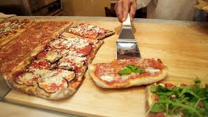 A slice of pizza from Farinella Bakery is delicious and easy to get for lunch. Source: Farinella Bakery
